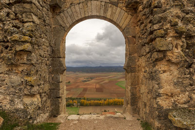 Scenic view of landscape against cloudy sky