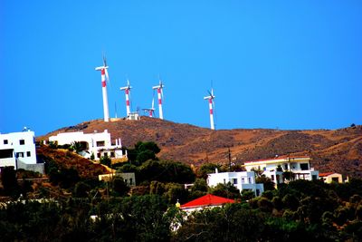 Traditional windmill against clear blue sky