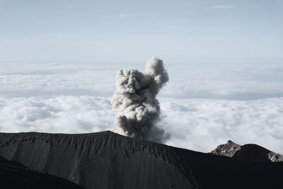 Scenic view of volcanic mountain against sky