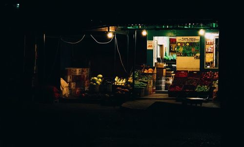 Illuminated street market at night