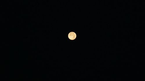 Low angle view of moon against sky at night