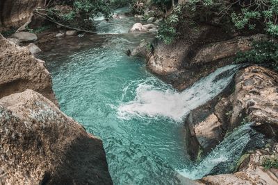 High angle view of rock formation in sea