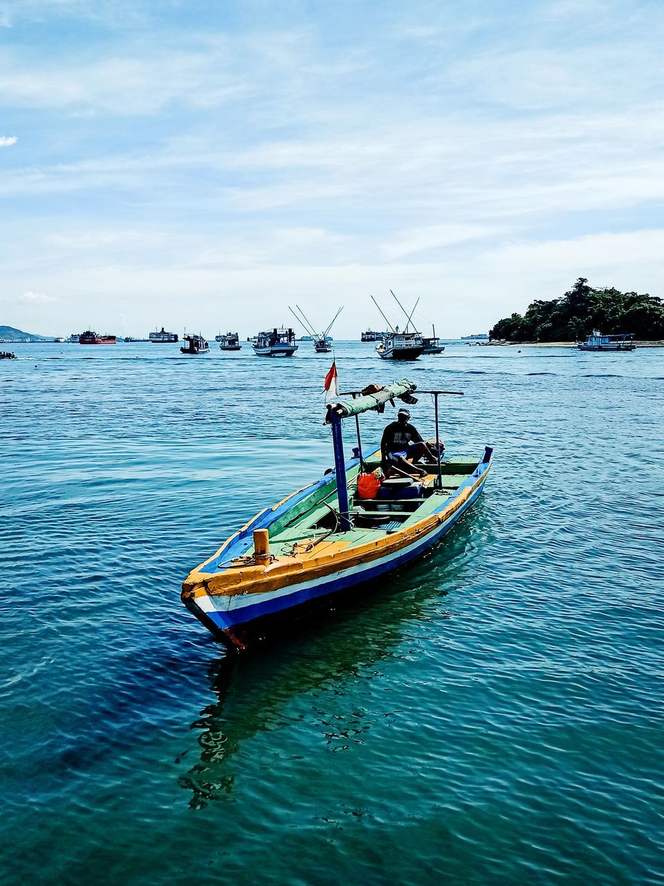 PEOPLE IN SEA AGAINST SKY