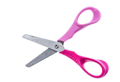 Close-up of scissor over white background