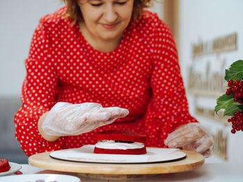 Midsection of woman preparing food at home