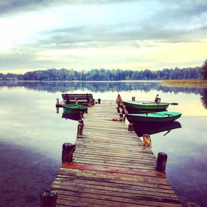 Pier on lake against sky