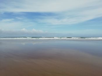 Scenic view of beach against sky