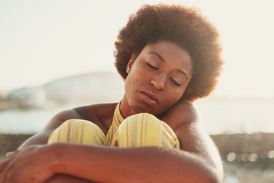 Portrait of young woman using mobile phone