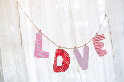 Close-up of clothespins hanging on clothesline