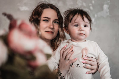 Portrait of smiling mother and daughter