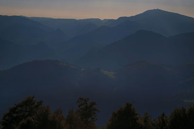 Scenic view of silhouette mountains against sky at sunset