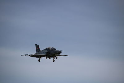 Low angle view of airplane against clear sky