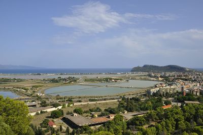 Panoramic view of sea and buildings against sky