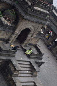 High angle view of people on steps of building