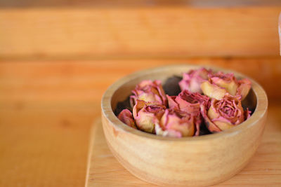 Close-up of chopped fruits in bowl on table