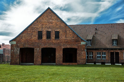 House on field against sky