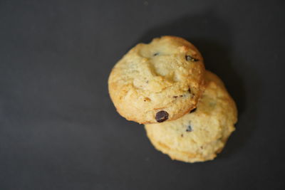 High angle view of cookies against black background