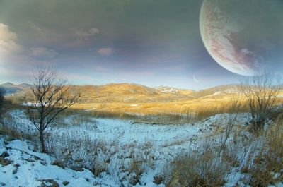 Scenic view of snow covered landscape against sky