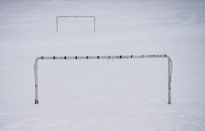 Soccer goal on snow covered field