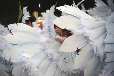 High angle view of woman standing on white flower