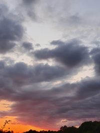 Low angle view of dramatic sky during sunset