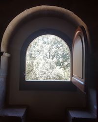 View of built structure through window