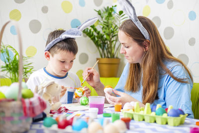 Portrait of smiling girl playing with toys on table