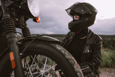 Portrait of man riding bicycle on motorcycle