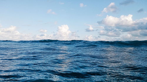 Scenic view of sea against cloudy sky