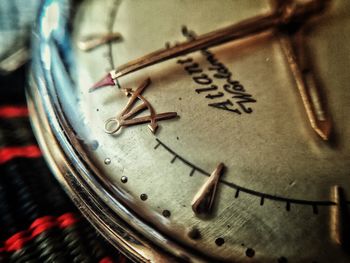 Close-up of clock on wall