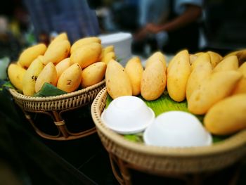 Close-up of mangoes in basket