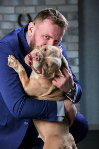 Portrait of man with dog