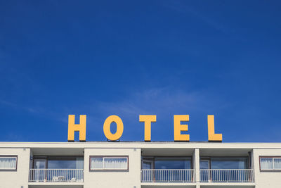 Low angle view of building against blue sky