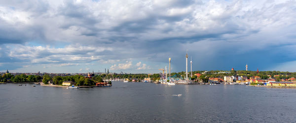 Panoramic view of buildings in city against sky