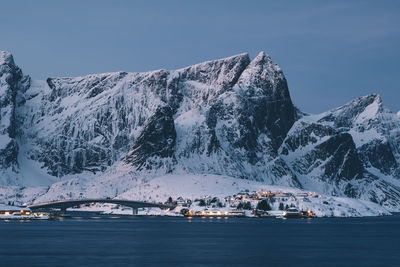 Scenic view of snowcapped mountains against sky during winter