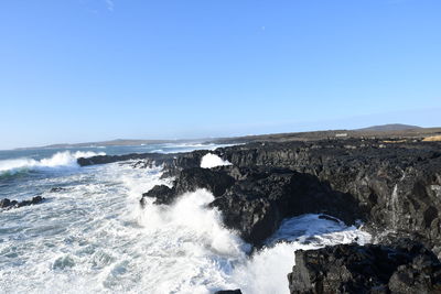 Scenic view of sea against clear sky