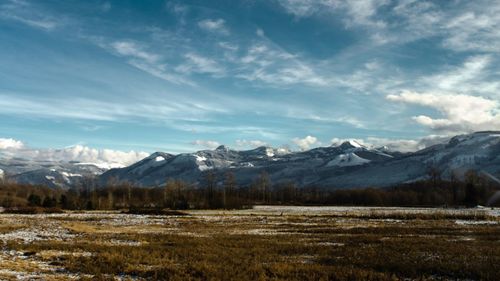 Scenic view of snowcapped mountains against sky