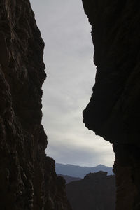 Silhouette of mountain against sky at dusk