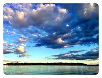 Scenic view of sea against cloudy sky