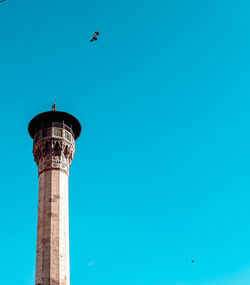 Low angle view of tower against clear blue sky