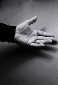 Close-up of man hand over white background