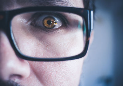 Close-up portrait of man wearing eyeglasses