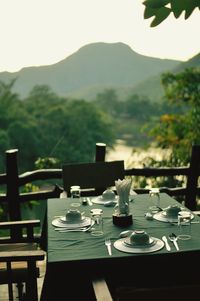 Empty chairs and table in cafe