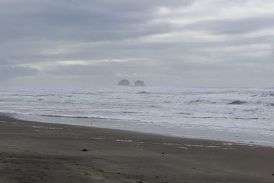 Scenic view of beach against sky