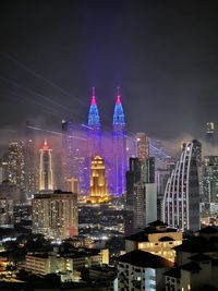 Low angle view of illuminated cityscape at night