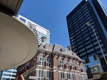 Low angle view of buildings against clear sky