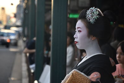 Close-up of woman with face paint at street