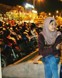 People on city street at night