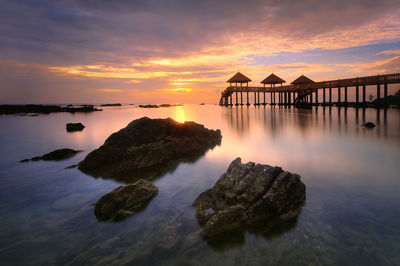 Scenic view of sea against orange sky