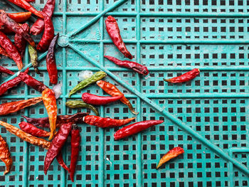 High angle view of red chili peppers on floor